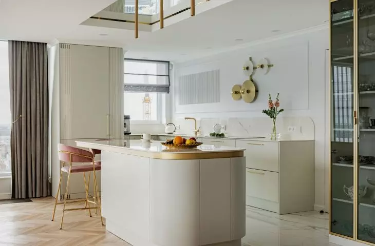 A mirror hangs above the kitchen island 