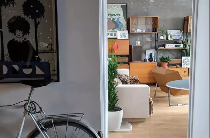 Paweł Wołejsza's private apartment, and in it, among other things, an exposed prefabricated reinforced concrete slab and a rescued communist-era Drzwotechnik modular furniture cabinet