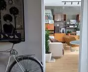 Paweł Wołejsza's private apartment, and in it, among other things, an exposed prefabricated reinforced concrete slab and a rescued communist-era Drzwotechnik modular furniture cabinet