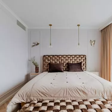 The bedroom is located behind a mirrored wall