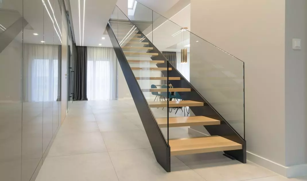Popular materials for staircases include wood, concrete, metal, stone, glass, laminates or wood-like panels. 