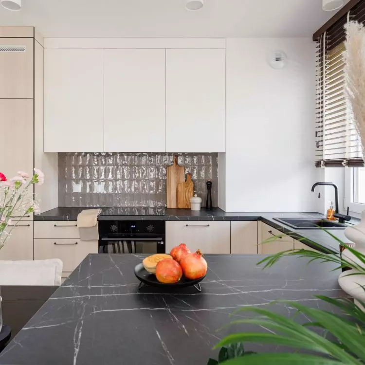 The tiles above the countertop resemble luxe tiles