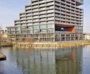 Nordic Haven apartment building also peeks through the waters of the Brda River, proj.: Nizio Design International