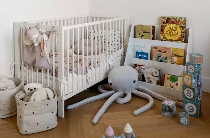 The children's room uses polka dot wallpaper