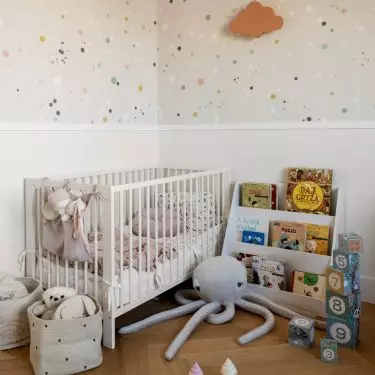 The children's room uses polka dot wallpaper