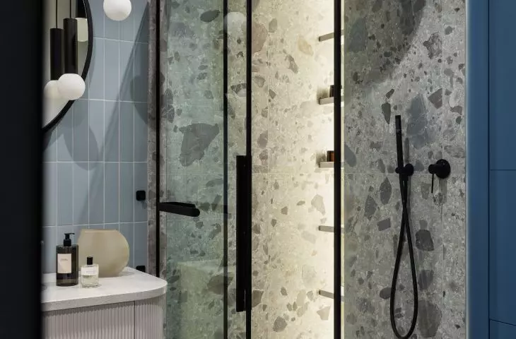 Blue bathroom and wall with terrazzo pattern tiles