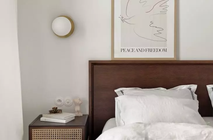 The bedside tables are decorated with Vienna plaid