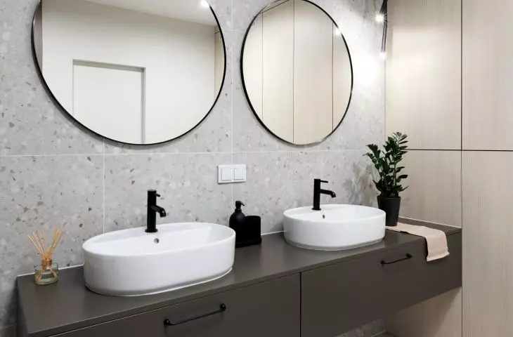 The main element of the arrangement is chocolate washbasin cabinets