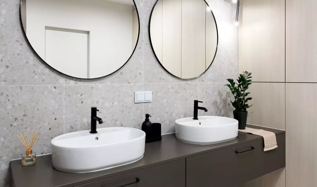 The main element of the arrangement is chocolate washbasin cabinets