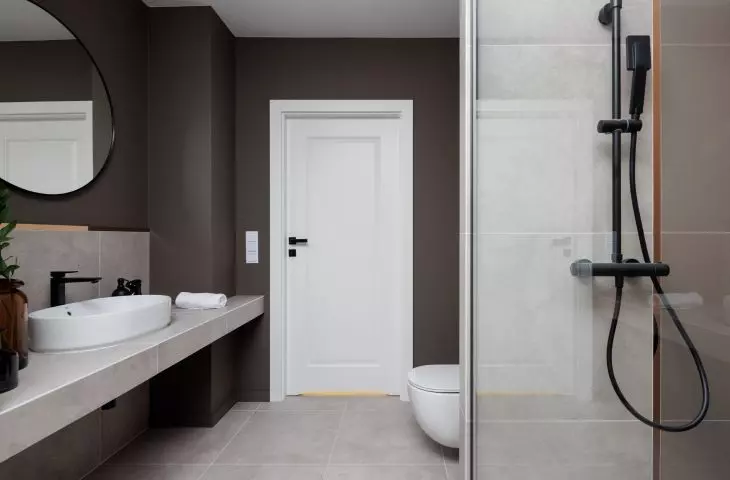 Deep brown shade warms up the space