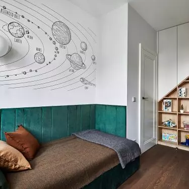 The wall of the first room was decorated with a space theme