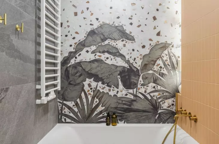 Upstairs bathroom stands out with wallpaper over bathtub