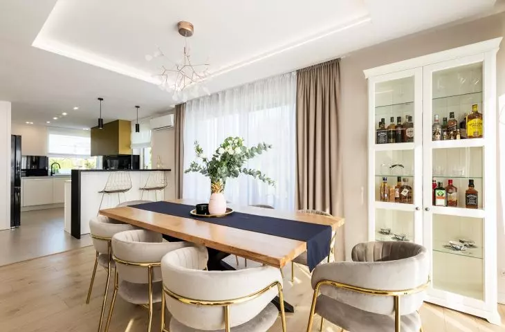 A large table with an oak top is the heart of the dining room