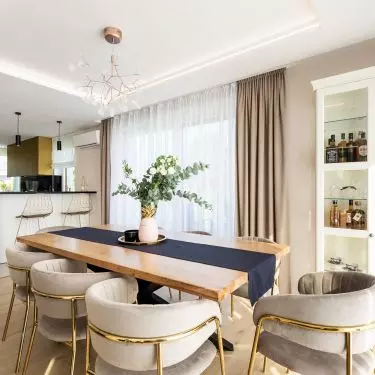 A large table with an oak top is the heart of the dining room