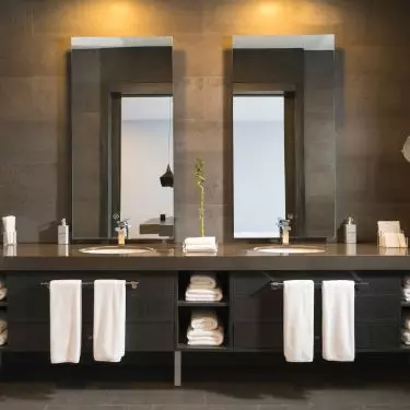 A sink built into the countertop is a stylish and safe solution, used in minimalist bathrooms. It will work well wherever order and simplicity are a priority