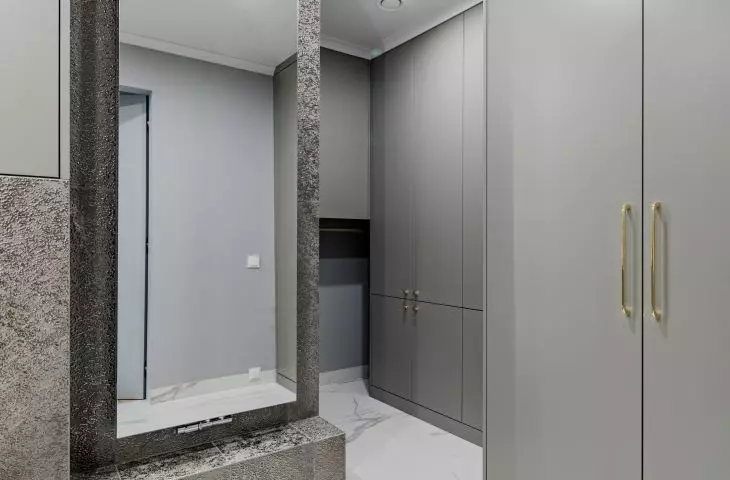 The utility room fits stylistically into the bathroom design