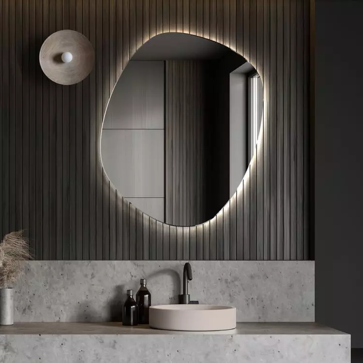 A mirror wider than the sink creates an interesting effect