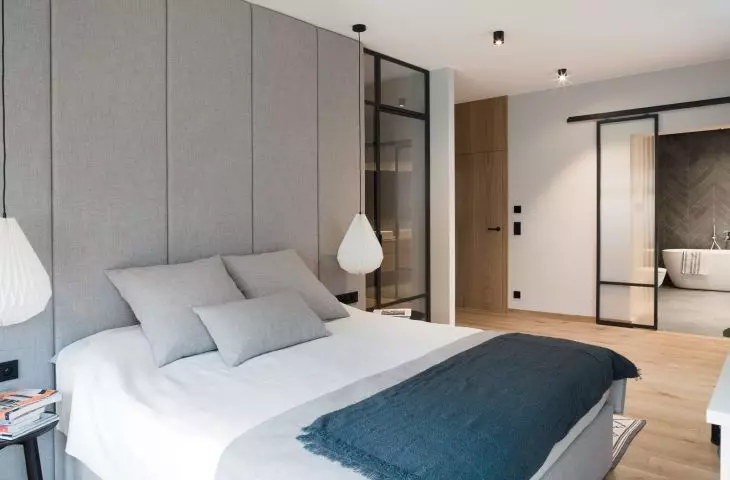 The headboard of the bed was covered with the same material that appears on the bed