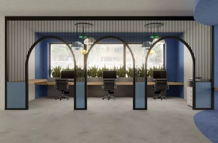 The main coworking area also features three workspaces separated by a metal bar structure
