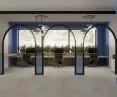 The main coworking area also features three workspaces separated by a metal bar structure