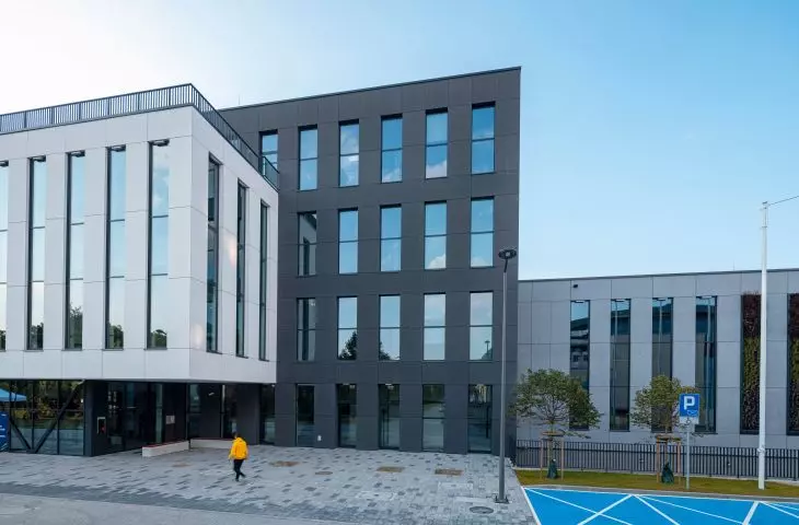 The facade of the sports hall building is made in three colors