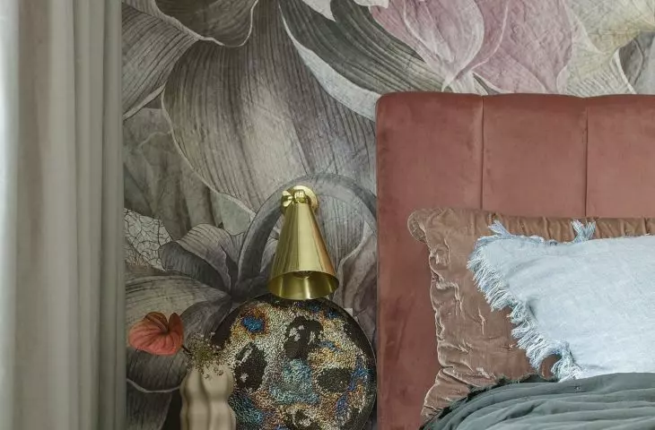 The bedroom is dominated by a combination of pink, orange, bottle green and cool blue