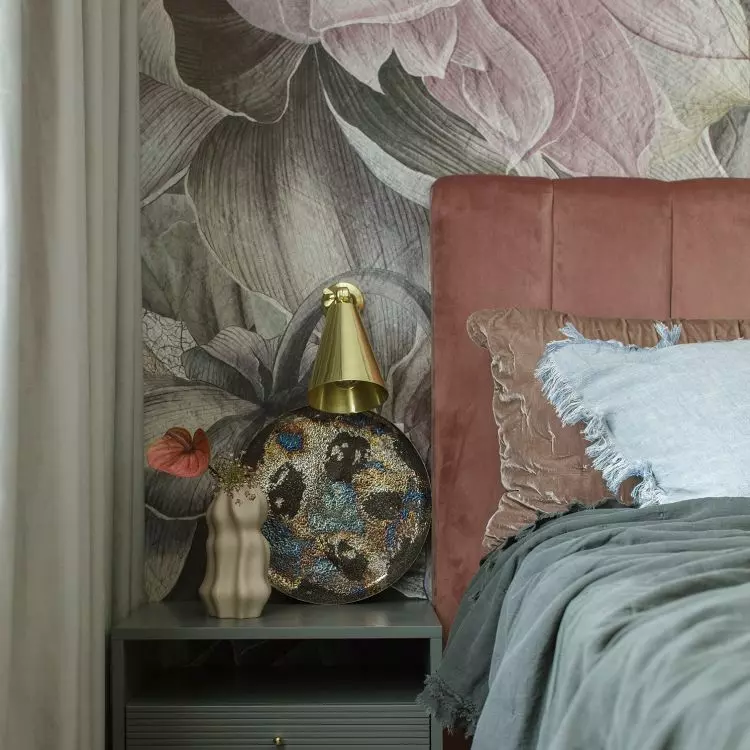 The bedroom is dominated by a combination of pink, orange, bottle green and cool blue
