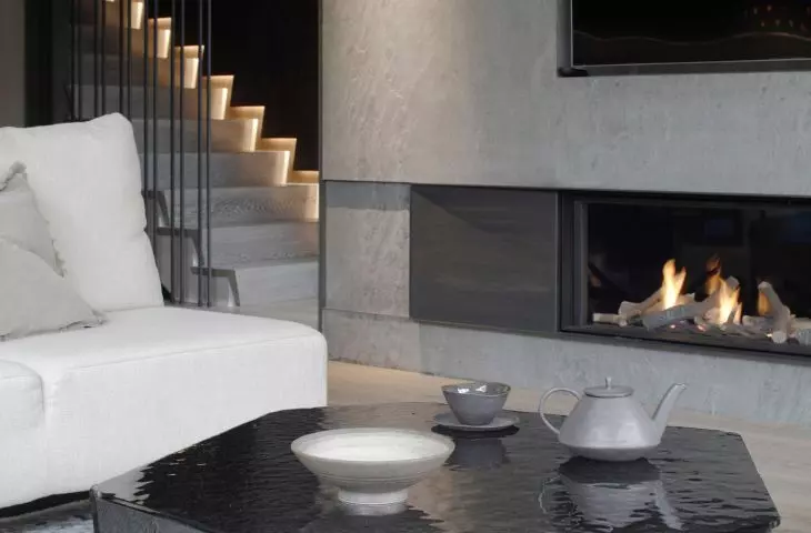 The wall with the TV was finished with stone