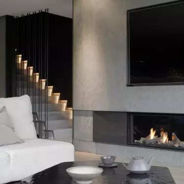 The wall with the TV was finished with stone