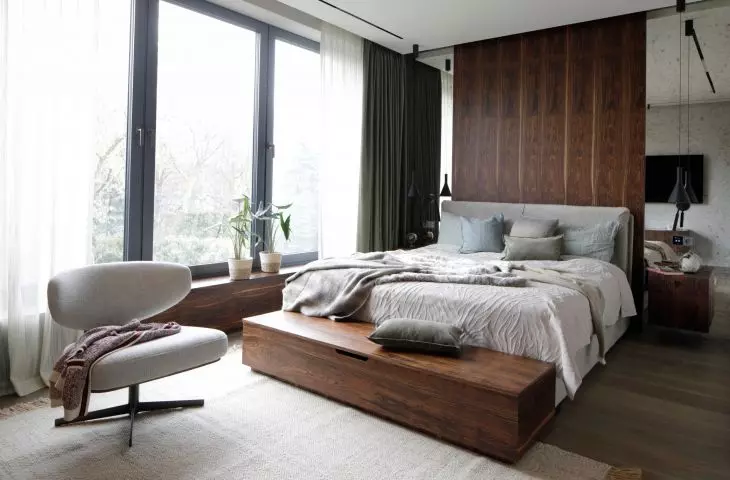 The bedroom is filled with wood veneer