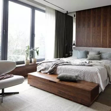 The bedroom is filled with wood veneer