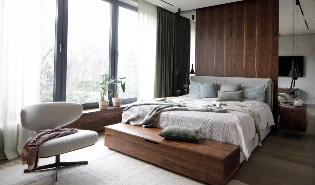 The bedroom is filled with wood veneer