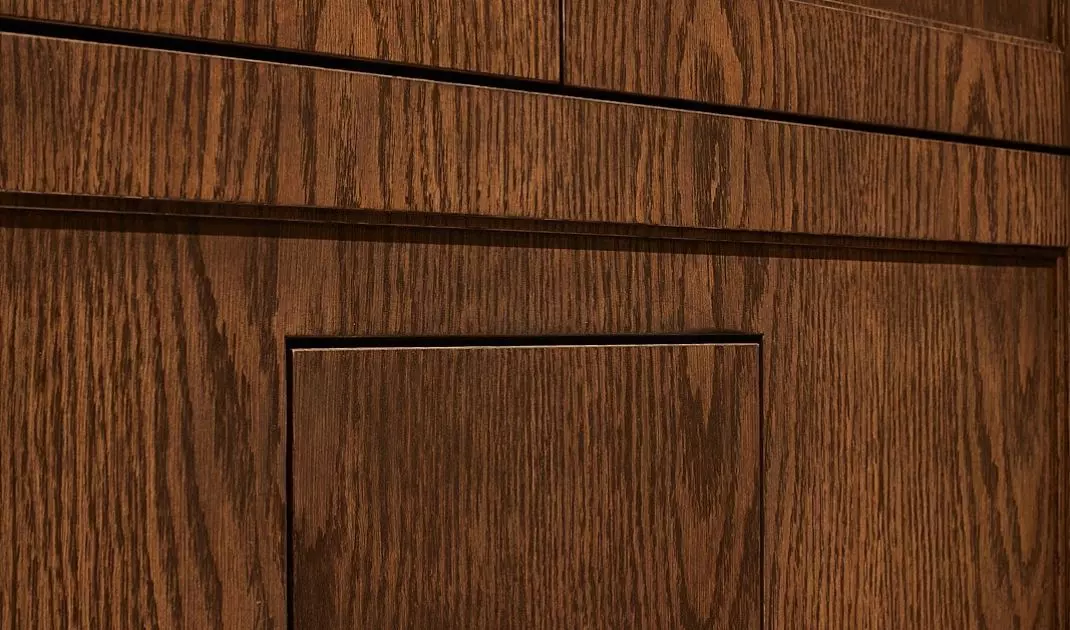 Flat toilet button blends with the wall 