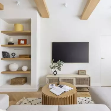 The focal point of the living room is the TV