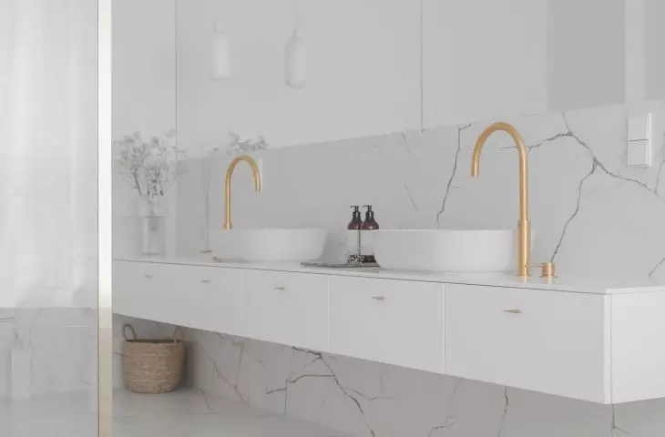 Two washbasins have been placed on a long piece of furniture
