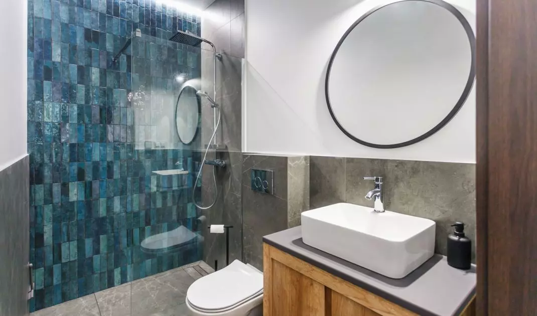 The bathroom uses Spanish mosaic tiles in the shape of a scale