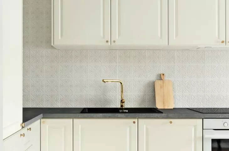 The floor in the kitchenette was tiled with patterned tiles