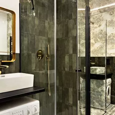 The bathroom is consistent in color with the rest of the apartment
