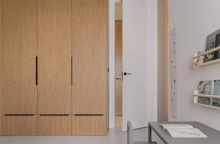 One of the walls in the children's room is formed by a closet
