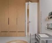 One of the walls in the children's room is formed by a closet