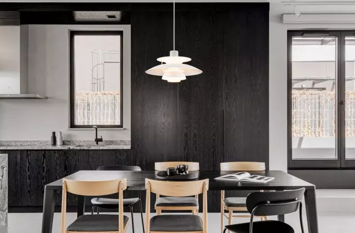 Dining area of the apartment - in the background, oak kitchen cabinets