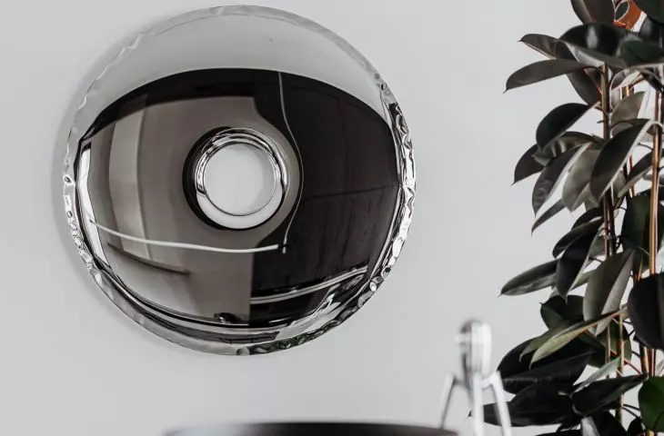 Oskar Zięta mirror, Starck lemon squeezer on the countertop