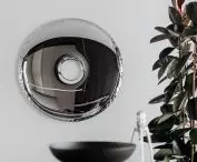 Oskar Zięta mirror, Starck lemon squeezer on the countertop