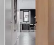 View from the hallway toward the kitchen, on the floor microcement