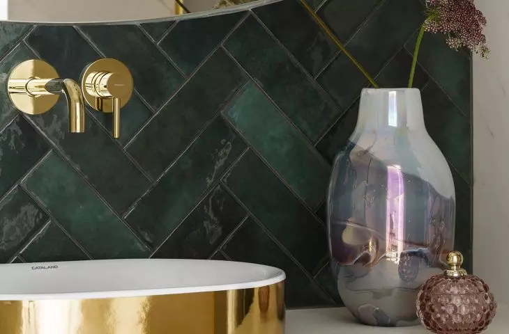 The basin is gold on the outside and white on the inside