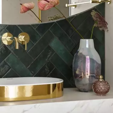 The basin is gold on the outside and white on the inside