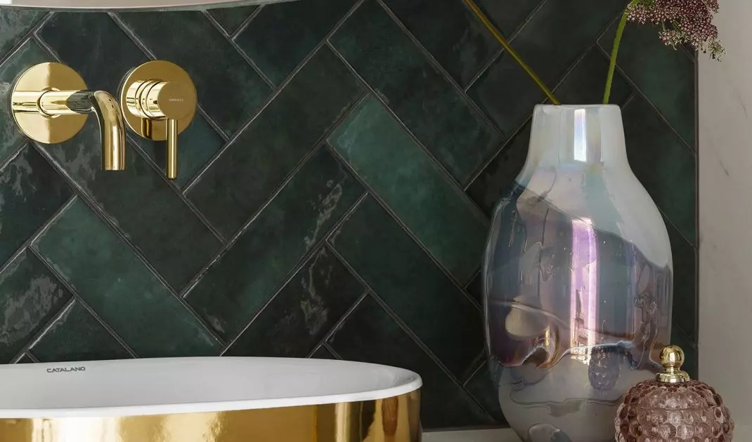 The basin is gold on the outside and white on the inside