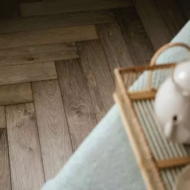 The floor was covered with planks in a classic herringbone pattern.