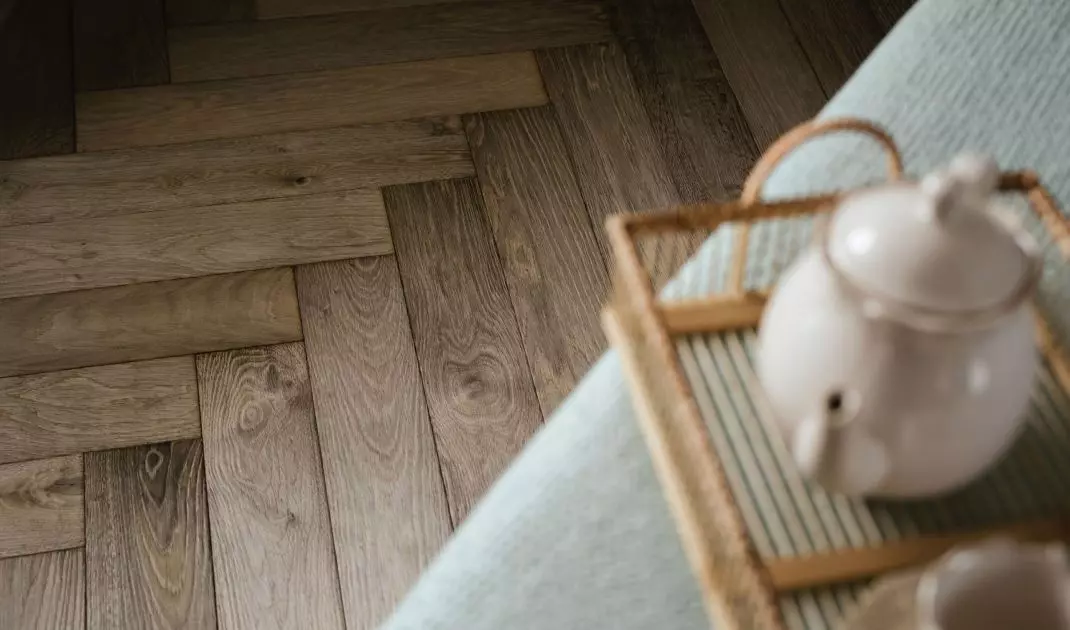 The floor was covered with planks in a classic herringbone pattern.