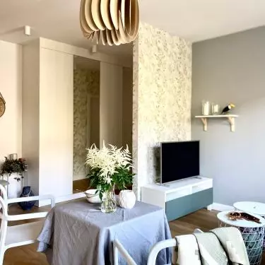 Apartment in Mokotow was decorated in earthy colors